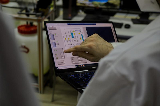 Inauguration of the newly constructed student lab "double tank system". Prof. Lucia remotely operates the system.